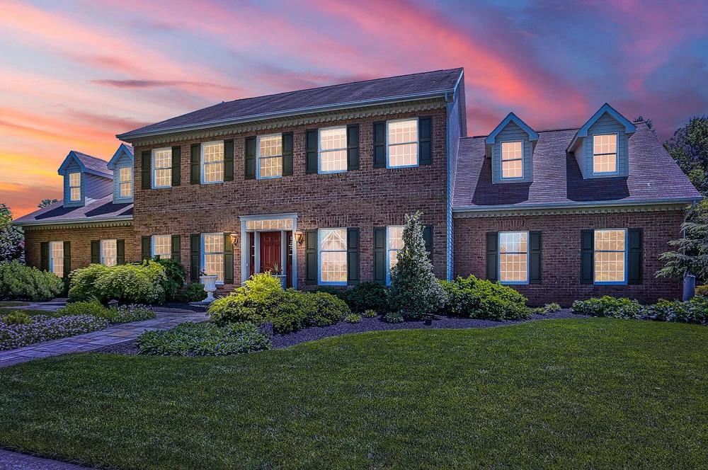 Brick colonial home in Lancaster County photographed at twilight
